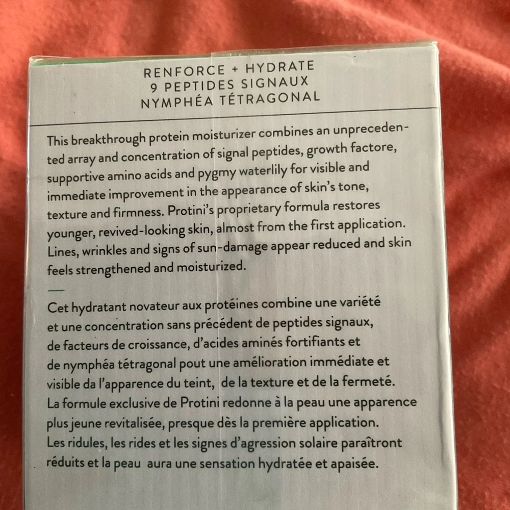 Drunk Elephant Facial Moisturizer with Green Text